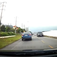Motorcyclist Tries to Kick Car