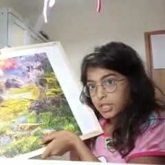 Girl shows her puzzle