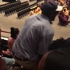 Man jumps over railing at graduation ceremony