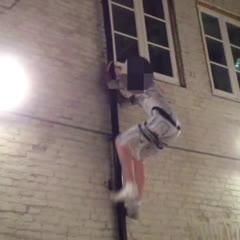 Drunk guy in Star Wars pajamas climbs a drainpipe then falls