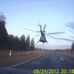 Low-flying Military Helicopter on the Highway