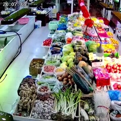Supermarket owner kicks escaped fish back into tank