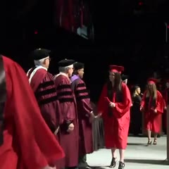 Davenport University student fails at backflip during graduation ceremony