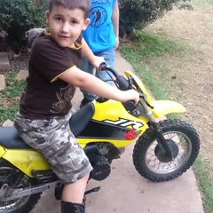 Little kid runs staight into fence with dirt bike