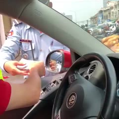 Man pays to police men for crossing a busy cross road