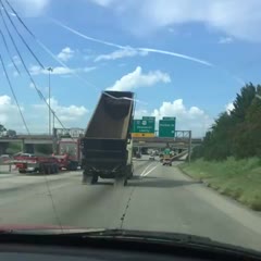 Dump truck takes out Houston freeway sign