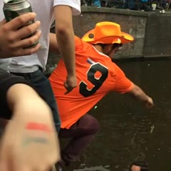 Breaking a boat on King's Day in Amsterdam (26-04-2014)