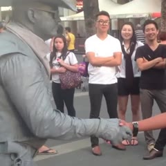 Guy gets punched by street performer!