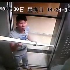 Guy gets long pipes stuck in elevator