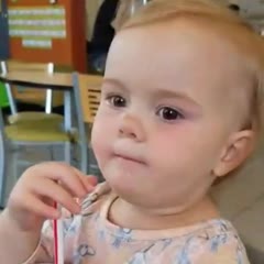 Evie's first sip of Coke