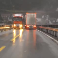 Man nearly crushed by truck almost getting blown over!