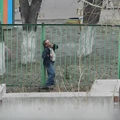 Russian Boy Saves a Drunk Man Climbing over Fence