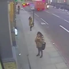 The moment a pair of moped-riding thieves snatched mobile phones from the hands of a woman and a man standing on a street in London