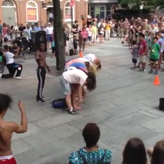 Street Performer Kicks Guys Head when Flipping Over 9 People