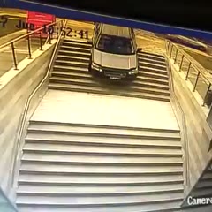 Driver woman confuses building entrance with parking lot and crashes