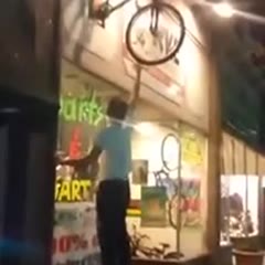 Guy Tries Climb Onto Bicycle, Gets Knocked Out