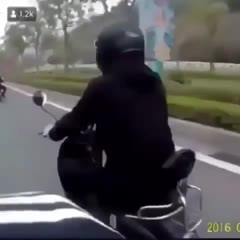 Guy sticks dildo on motorcycles helmet