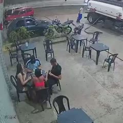 Lighting a cigarette at a gas station