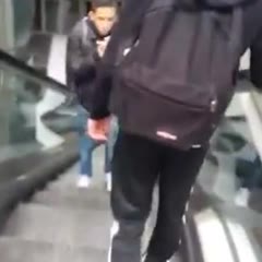 Dude falls down escalator