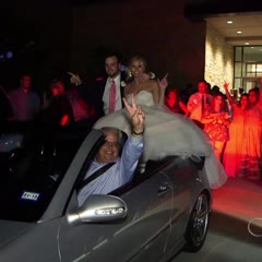 Newlywed couple falls off the back of a car