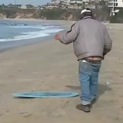 Drunk Homeless Man Tries To Skimboard