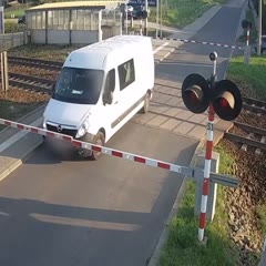 Train slams into van at railway crossing in Poland	